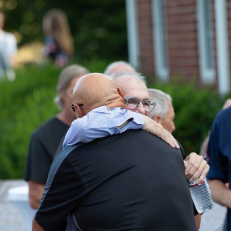 a group of men hugging