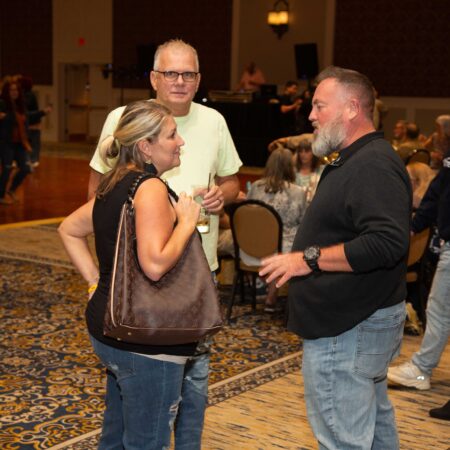 a group of people standing in a room