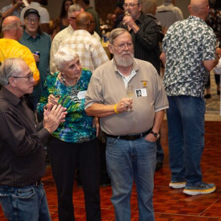 a group of people standing in a room